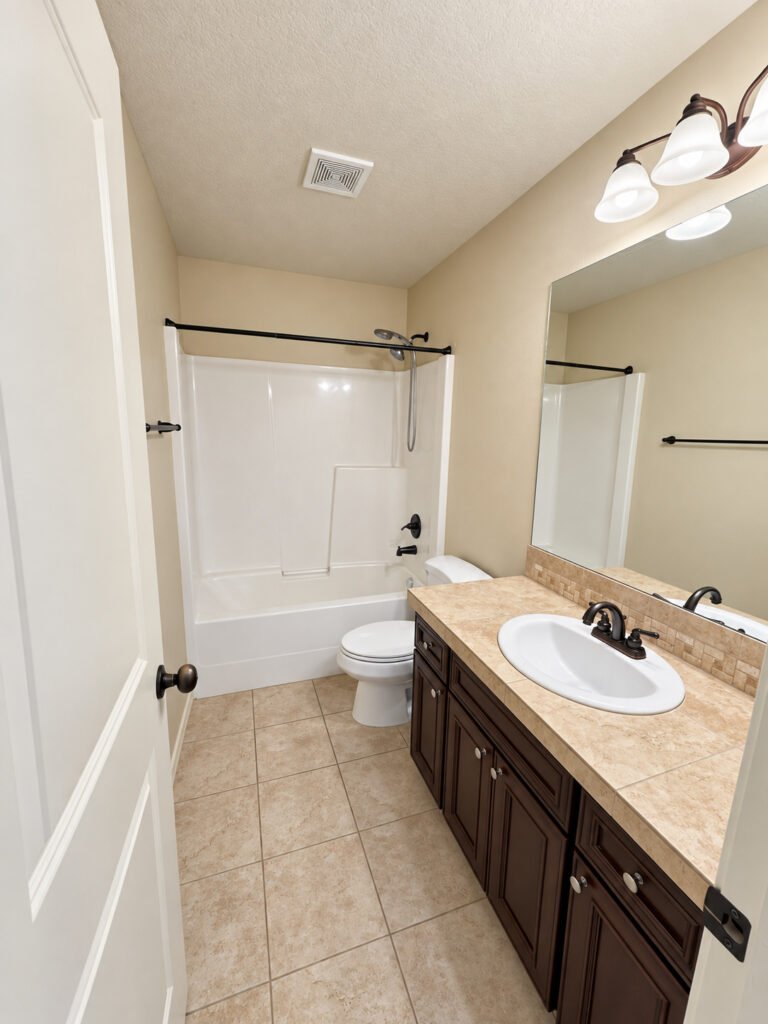 Hall bathroom with tub and shower