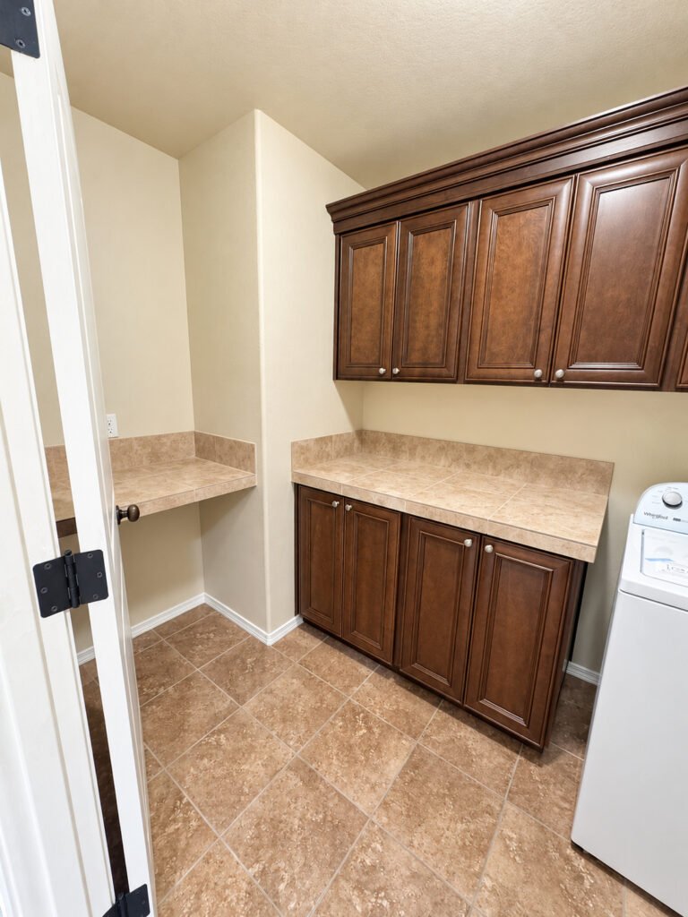 Laundry room with cabinets and counter