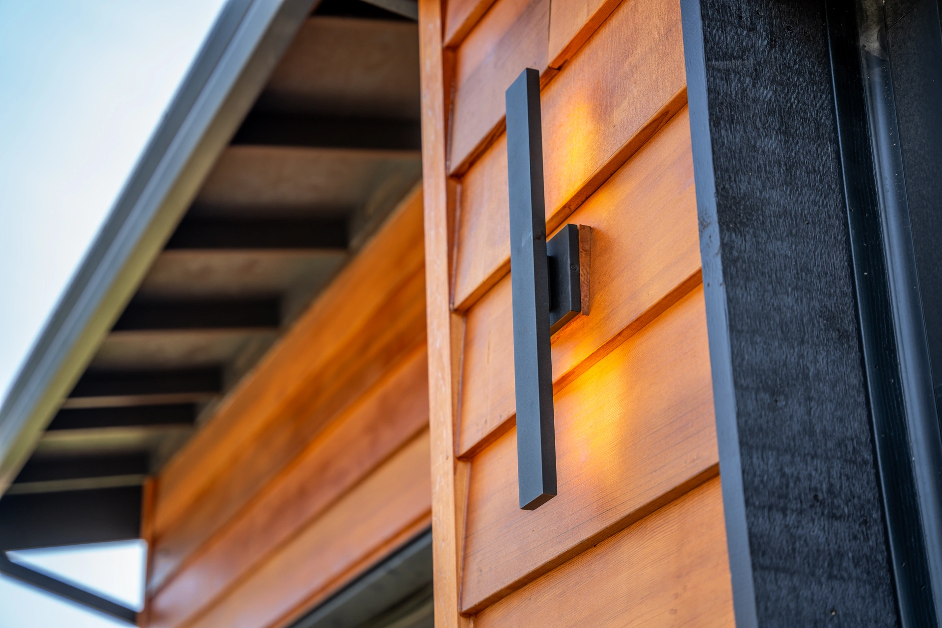 Cedar siding and black trim detail