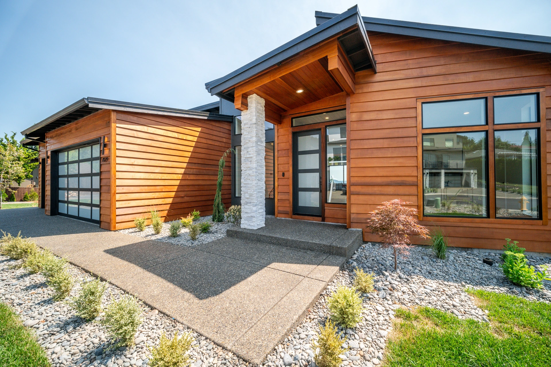 Cedar and glass home with covered entry